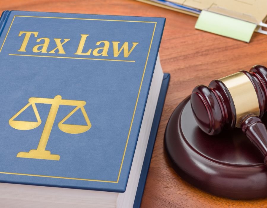 IRS penalty relief and tax law guidance illustrated by a tax law book and gavel for taxpayers seeking abatement.