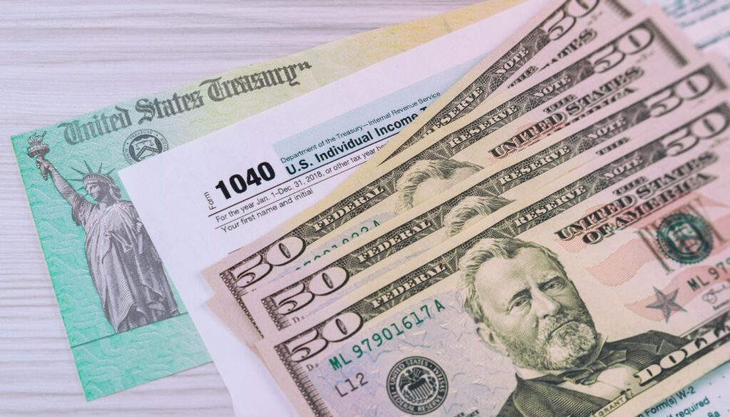 IRS penalty abatement reducing tax penalties with U.S. Treasury check and cash