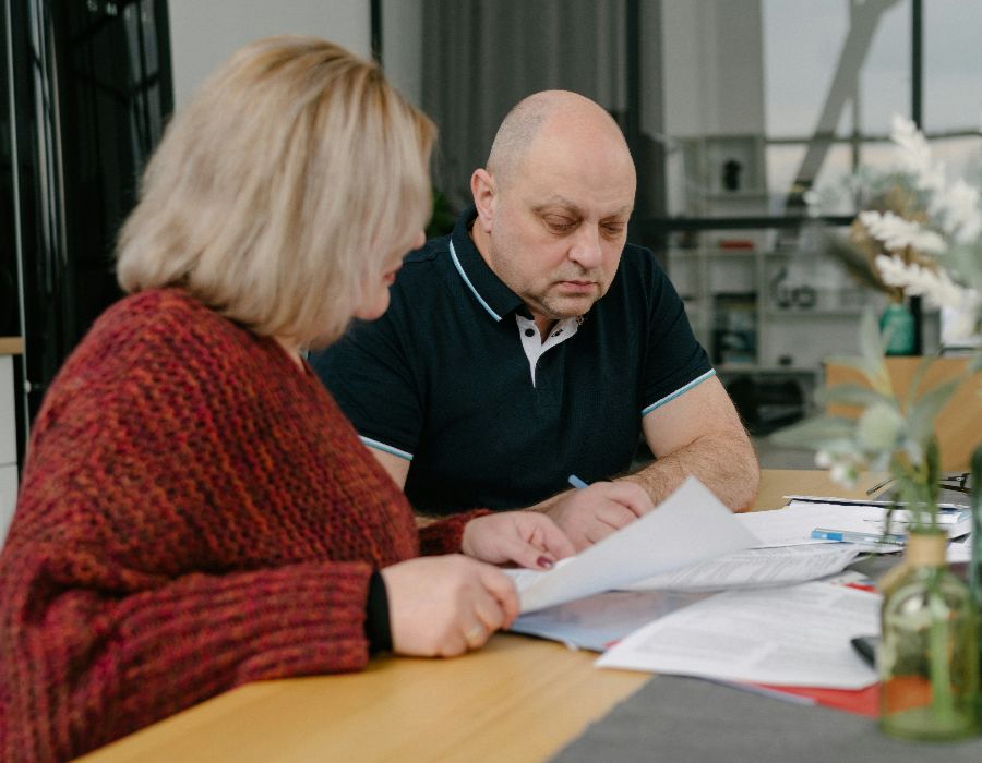 Couple reviewing IRS levy notice involving a joint bank account