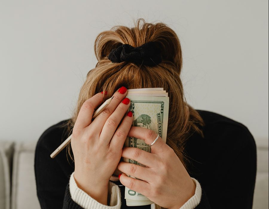 Taxpayer reviewing a paycheck after receiving an IRS wage garnishment notice.