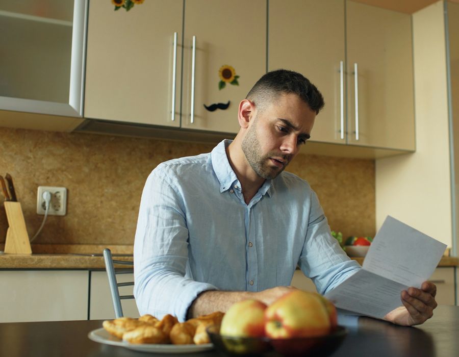 Taxpayer reviewing IRS tax lien notice and financial documents